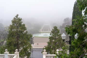Great fountain of the large park, Jose Antonio Labordeta from Zaragoza on a foggy day