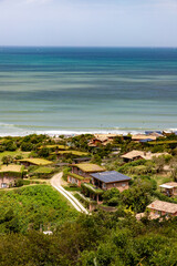 Beach with houses and vegetation