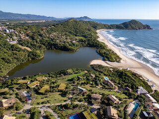Aerial view of lake, forest and beach