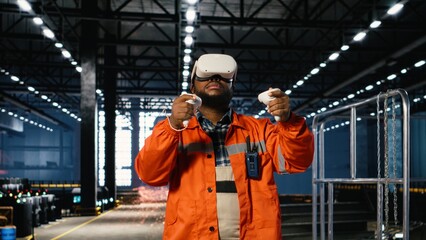 Black engineer wearing VR glasses interacting with a simulation system to analyze manufacturing process improvements. Steel machinery and industrial equipment for plant activity.