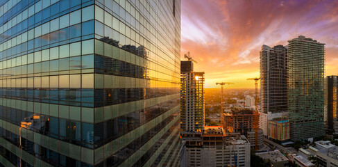 Miami, Florida. Developing American megapolis with new high-rise buildings under construction at sunset © bilanol