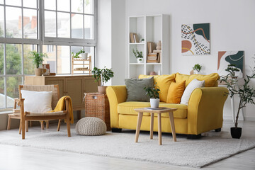 Stylish interior of living room with comfortable furniture