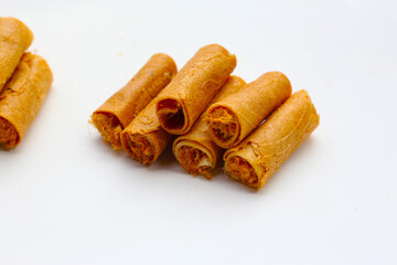 Rolled crispy wafers filled with shredded pork floss, Thai snack.