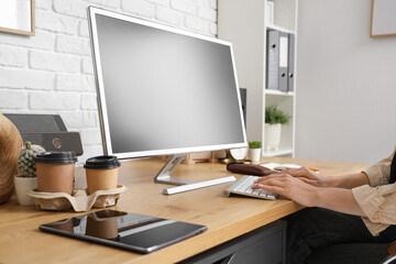 female hands working with computer in modern office. Closeup