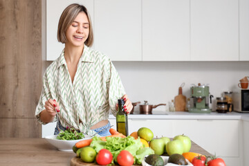 Young woman making vegetable salad in kitchen. Keto diet concept
