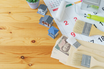 カレンダーと塗装道具と日本のお金｜DIY・リフォーム・塗装業者・スケジュールと費用　イメージ