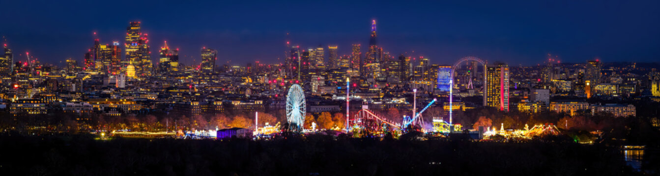 London Skyline and Christmas Fair in Hyde Park at Twilight