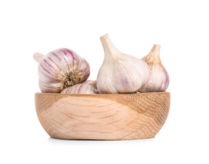 Wooden bowl with fresh garlic on white background