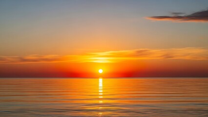 Naklejka premium Serene Ocean Sunset with Fiery Sun Reflecting on Calm Water, Creating a Peaceful Ambiance