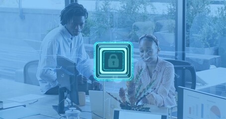 Working colleagues typing on laptop in office woman blouse headband man shirt, digital lock overlay