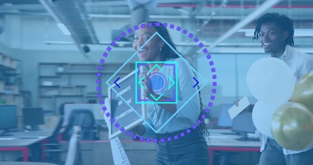 Woman in light shirt carrying screen and walking in office, coworker holding balloons and card, HUD