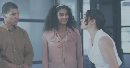 Talking colleagues exchanging ideas in modern office, glass partition, headband, business casual