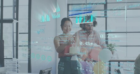 Celebrating three colleagues wearing business attire sharing lit cake in office, with financial HUD