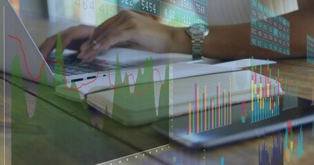 Typing woman in short sleeves using laptop at workspace, tablet, silver watch, financial charts