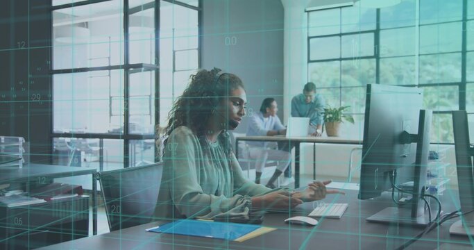 Typing office worker in light green blouse checking tablet and monitor at office desk, with overlay