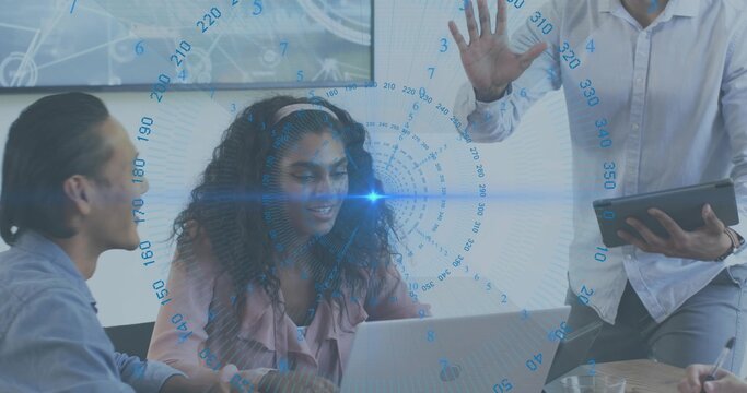 Presenting woman with curly hair wearing light blouse sharing laptop data in meeting, HUD overlay