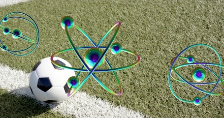 Resting black-and-white soccer ball on white sideline of artificial turf, with iridescent orbitals