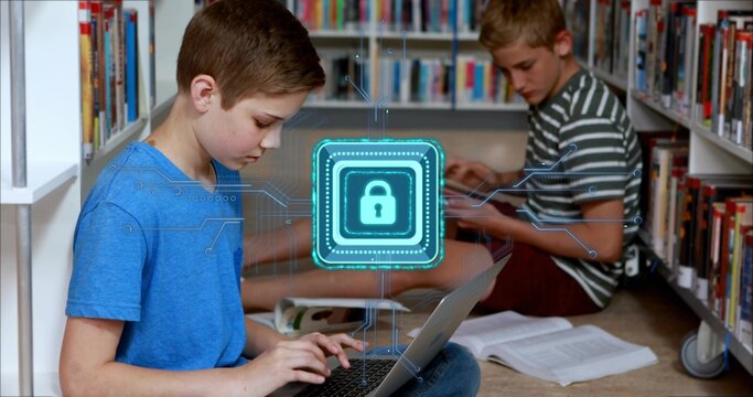 Typing left boy in blue-tshirt using laptop in school library aisle, padlock-hologram, copy space