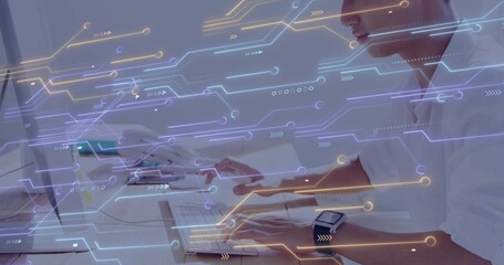 Working male in white shirt using monitor, smartwatch at office desk, circuit overlay, copy space