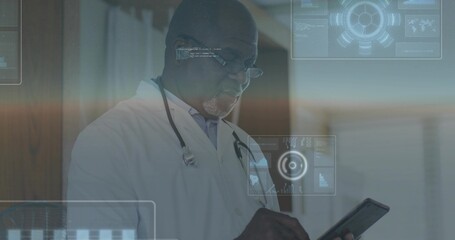 Holding tablet, physician wearing lab coat, stethoscope and glasses examining AR data in corridor
