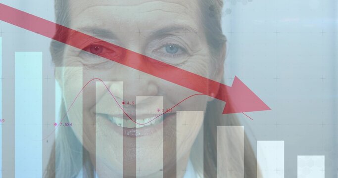 Senior woman merging bar chart, line graph and red downward arrow in studio, wearing collared shirt - Powered by Adobe