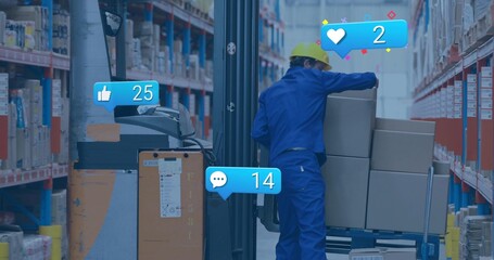 Worker in blue coverall yellow hat steadying boxes on pallet jack in warehouse aisle, with overlays