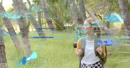 Standing hiker in mustard cardigan in grass clearing, carrying pack, mat, holograms, copy space