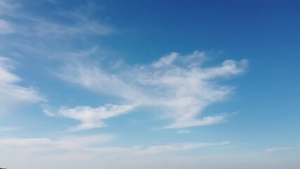 Ethereal Mists Cloud Formations Drift Across Sky with cloud formations moving slowly, aerial effect Ethereal Mists style featuring cloud formations, aerial footage, misty landscapes, nature