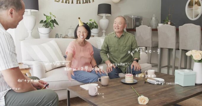 Couple moving to birthday cake, man adjusting candles and woman guiding guest, formulas overlaying