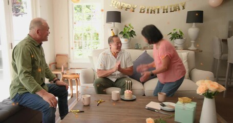 Woman coming with lit cake starting birthday, celebrant clapping, couple hugging, friend shaking