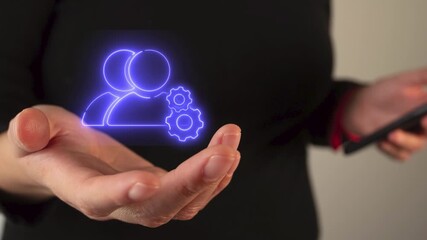 Virtual profile manager icon, held by a woman's hand	