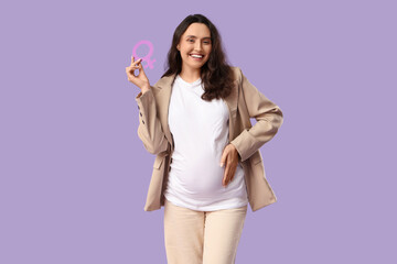 Young pregnant woman with gender symbol on lilac background
