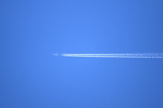 White contrails created by jet airplane flight