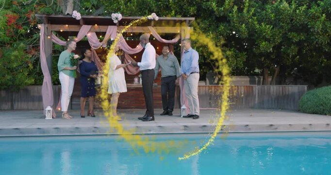 Couple exchanging rings at pergola, golden ring sweeping over stage and pool, marking wedding union
