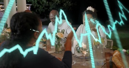 Back woman placing salad plate on dining table, woman in white pointing, turquoise wave sweeping