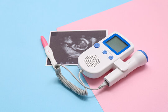 Fetal doppler with sonogram image and pregnancy test on color background