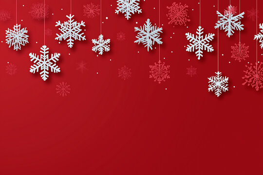 Hanging white and red snowflakes on a red background for christmas theme