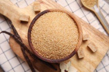 Bowl of vanilla sugar and pods on napkin