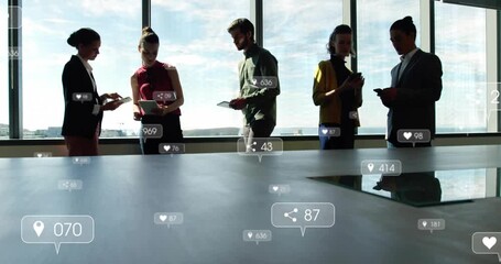 Five coworkers standing by window, tapping devices and sharing tablet, updating business overlays - Powered by Adobe
