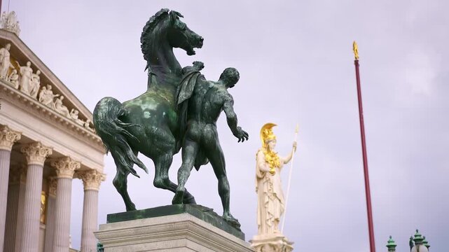 Pallas Athena Fountain statue located in front of the Austrian Parliament Building in Vienna, Austria. Travel destination for tourist visiting Austria. Europe summer tourism.
