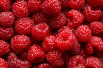 Fresh ripe raspberries as background, top view