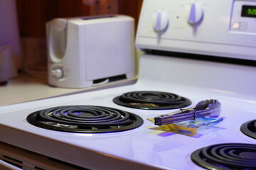 Kitchen Stove With Toaster and Metal Tongs