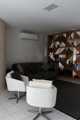 modern living room interior design, white floor and stylish wooden furniture, contemporary residential architecture, spacious apartment lounge area, white design armchairs and natural light