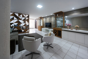 modern living room interior design, white floor and stylish wooden furniture, contemporary residential architecture, spacious apartment lounge area, white design armchairs and natural light