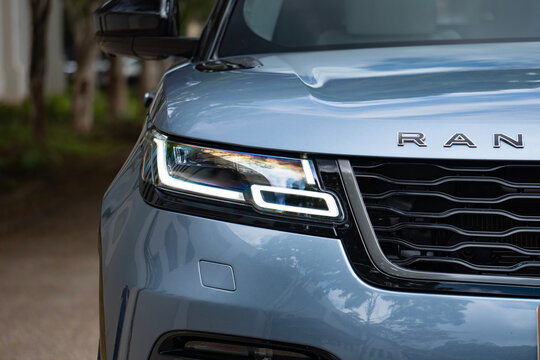 Blue Range Rover Velar LED headlight closeup, Luxury SUV exterior detail
