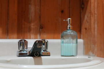 Bathroom Sink With Chrome Faucet and Soap Dispenser