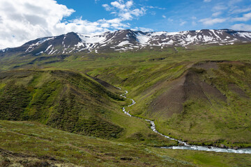 Mountain landscape with a stream in the valley. Highlands, Scotland