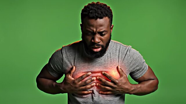 Man Experiencing Chest Pain And Discomfort On A Green Screen Background Isolated