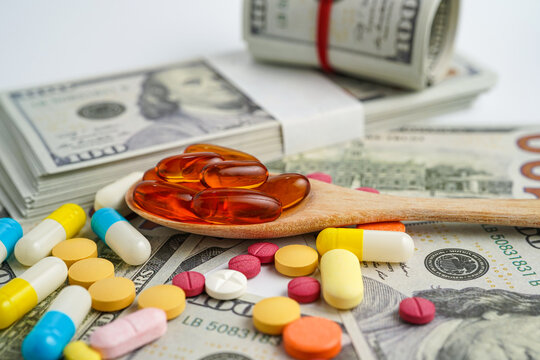 Pills on money dollars, Medicine prescription drugs cost concept, healthcare expenses