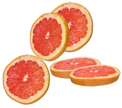 close-up studio photograph of four perfectly sliced pink grapefruits arranged in a group, highlighting the juicy segment structure and appealing pulp texture, isolated on black.